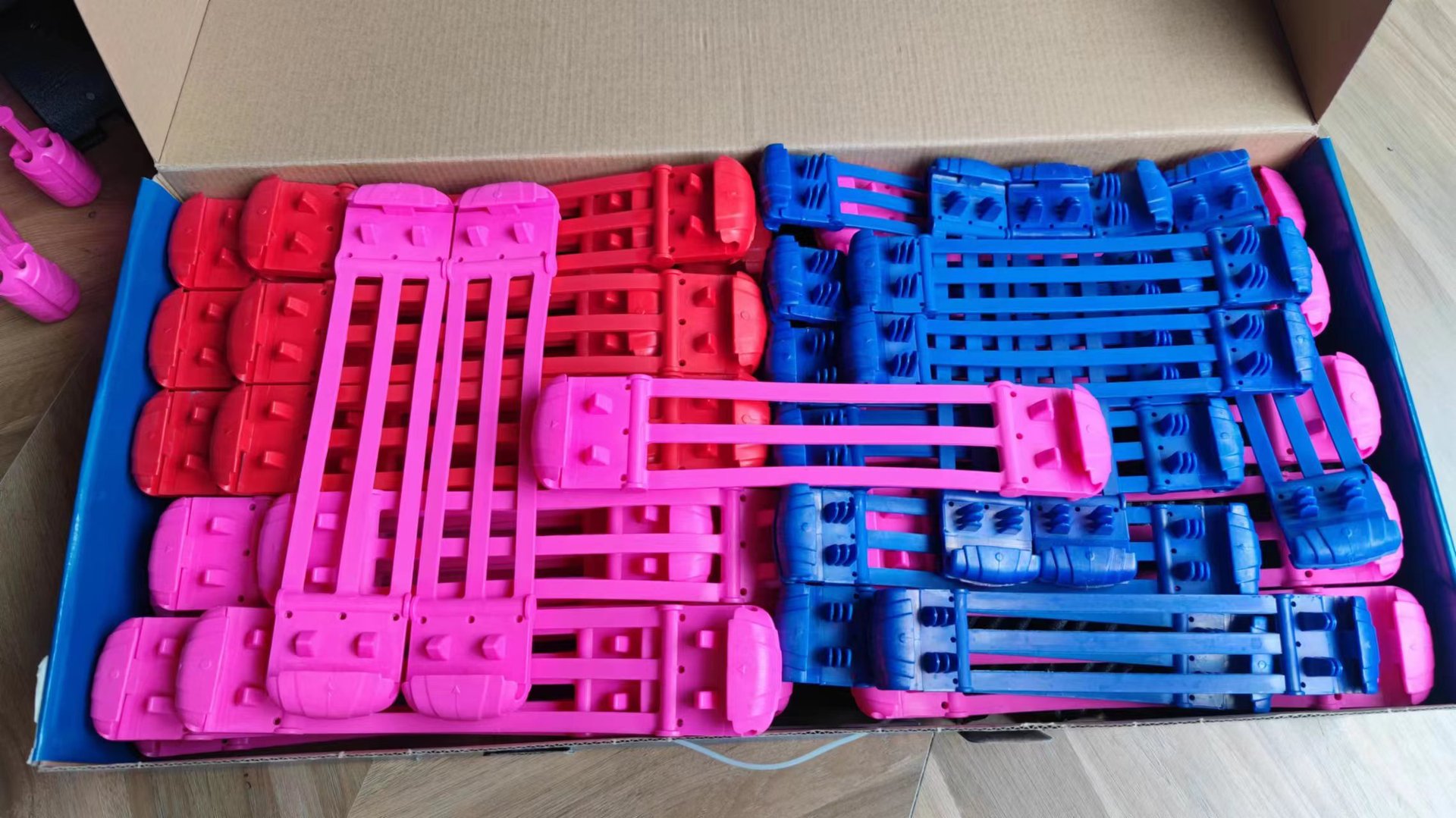 Bulk packed blue, red, and pink Spring replacement parts for wholesale orders